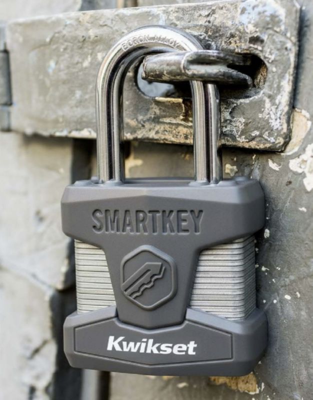 Kwikset SmartKey padlock on a metal gate